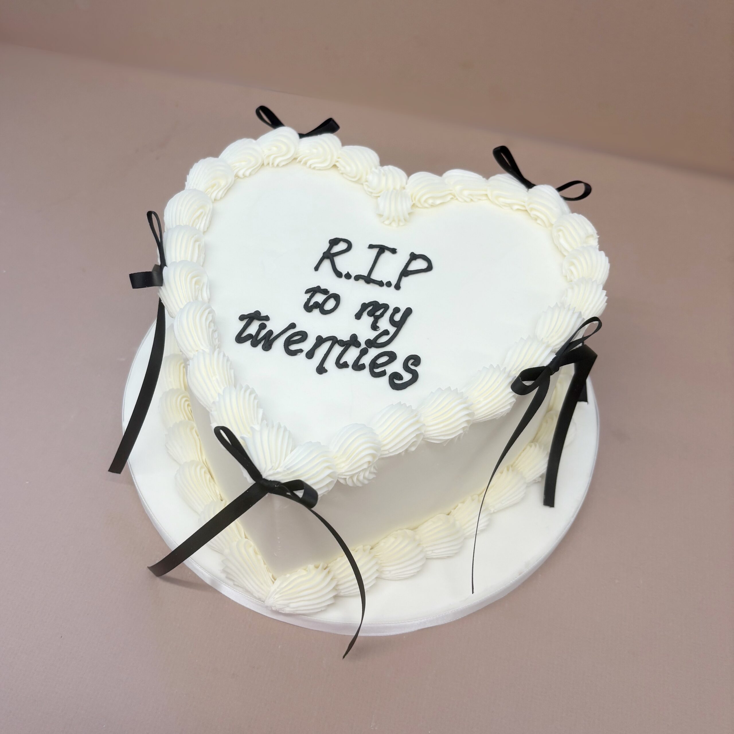 RIP Twenties Cake. Heart Cake with black bows